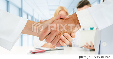 Doctor working in hospital with other doctors. 54536192