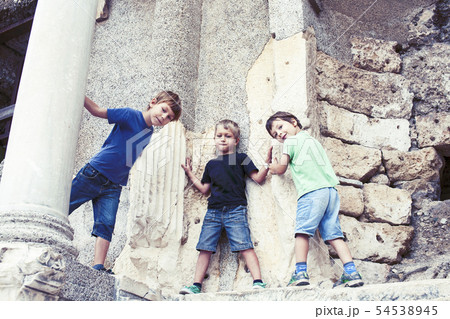 little boy exploring ancient architecture, lifestyle people on summer vacation close up little boy exploring ancient architecture, lifestyle people on summer vacation close up 54538945