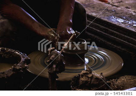 Close up hand of potter do a clay vase thai style. 54543301