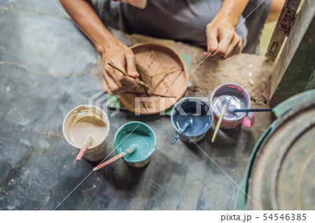 mother and son doing ceramic pot in pottery workshop 54546385