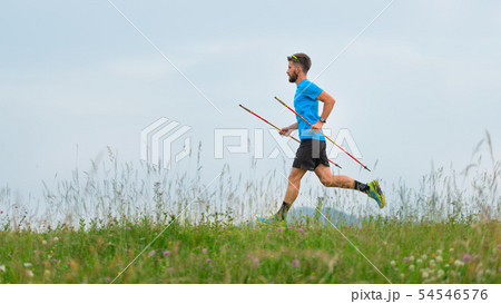 Mountain runner during the preparation of a long 54546576
