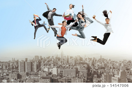 Office workers or ballet dancers jumping above the city Office workers or ballet dancers jumping above the city 54547006