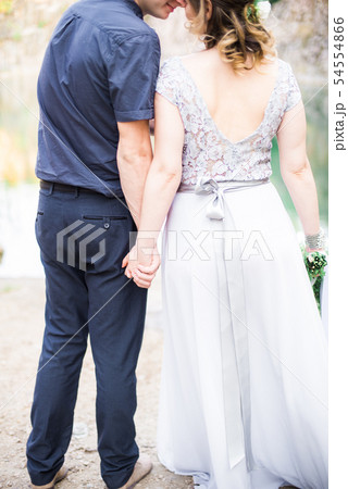 Elegant gentle stylish groom and bride near river Elegant gentle stylish groom and bride near river 54554866