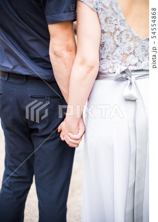 Elegant gentle stylish groom and bride near river Elegant gentle stylish groom and bride near river 54554868