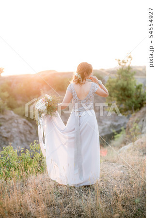 Beautiful young bride with in a wedding  dress  54554927