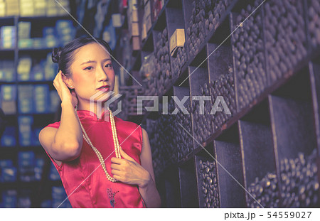 Chinese teenager seller worker in a steel metal Chinese teenager seller worker in a steel metal 54559027