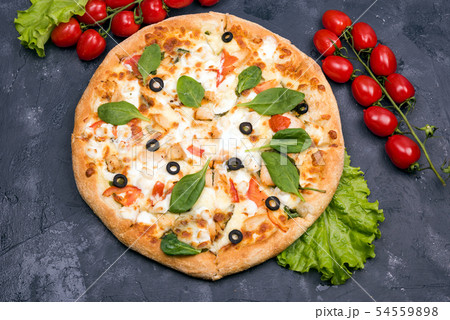 Pizza with mozzarella slices of olives and green salad top view 54559898