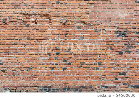 Old damaged worn brick wall background 54560630