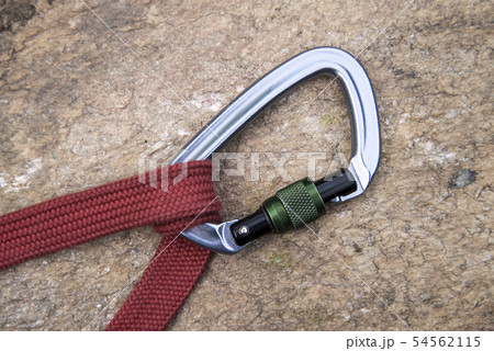Image of a carabiner hook and red rope Image of a carabiner hook and red rope 54562115