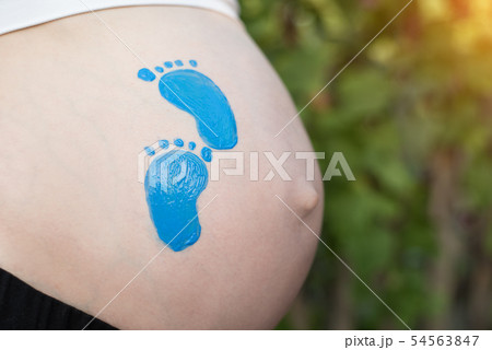 Blue little footprint drawning on pregnant female 54563847
