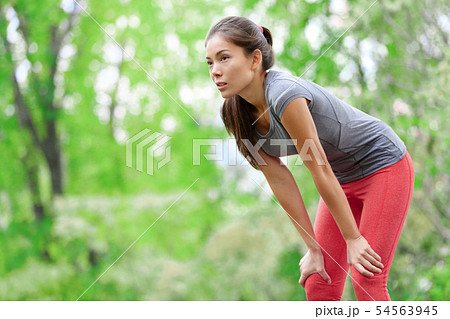 Asian woman athlete runner resting after running 54563945