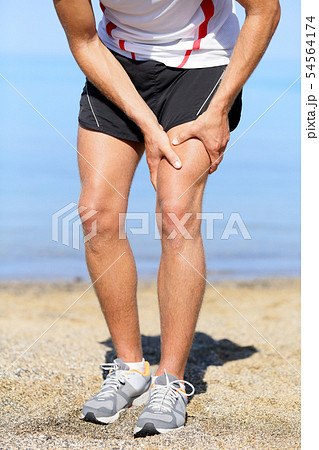 Muscle injury. Man runner sprain thigh muscles 54564174