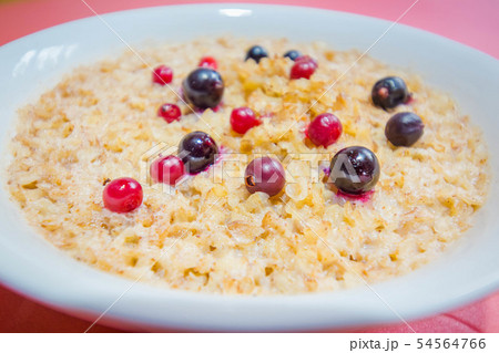 Tasty buckwheat porridge with milk and berries 54564766