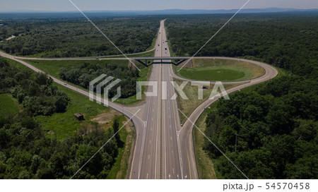 Aerial view of highway cloverleaf interchange seen from above. Aerial view of highway cloverleaf interchange seen from above. 54570458