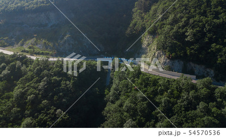 Curved asphalt highway road in mountains of South Russia Curved asphalt highway road in mountains of South Russia 54570536