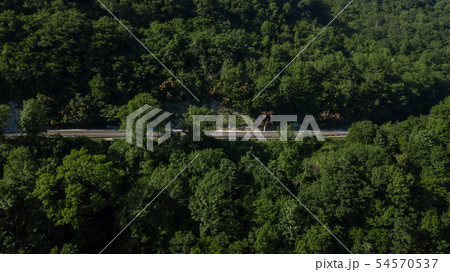 Curved asphalt highway road in mountains of South Russia 54570537