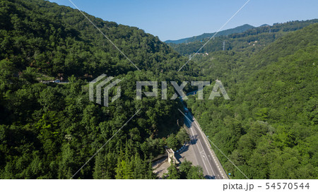 Curved asphalt highway road in mountains of South Russia 54570544