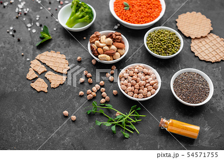 Healthy vegan food on a concrete background Healthy vegan food on a concrete background 54571755