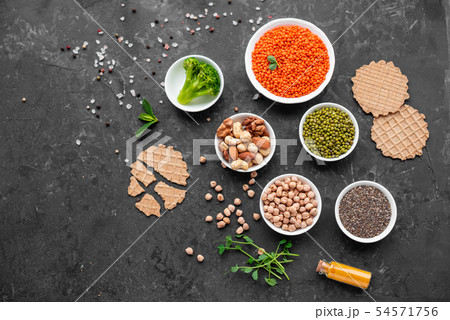 Healthy vegan food on a concrete background Healthy vegan food on a concrete background 54571756