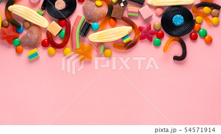 assortment of colourful lollipops and candies on assortment of colourful lollipops and candies on 54571914