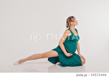 pregnant woman engaged in recreational gymnastics pregnant woman engaged in recreational gymnastics 54572449