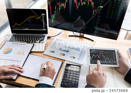 Team of stockbrokers Discussing with display scree 54573069