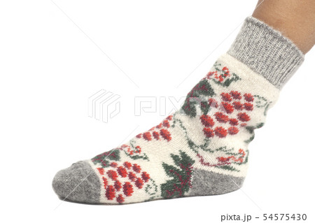 Wool sock on woman's feet isolated on white Wool sock on woman's feet isolated on white 54575430