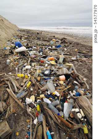 Trash beach pollution. Plastics and wastes Trash beach pollution. Plastics and wastes 54577970