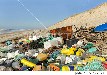 Garbage, plastics and waste washed up on a beach Garbage, plastics and waste washed up on a beach 54577974