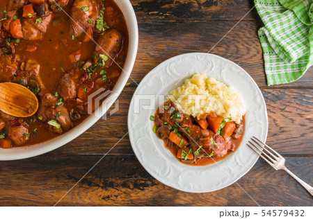 Coq au Vin, traditional French recipe of chicken Coq au Vin, traditional French recipe of chicken 54579432
