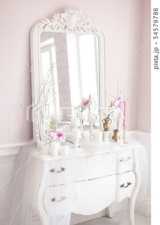 Royal bedroom. Place for make-up girls. Elegant white dressing table with mirror in light classic 54579786