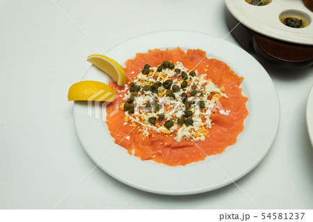 Salmon slice by fork knife with experience chef 54581237