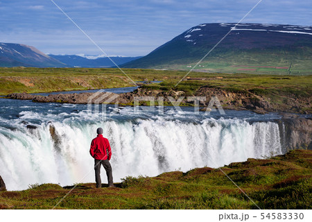 Tourist at the Godafoss waterfall Tourist at the Godafoss waterfall 54583330