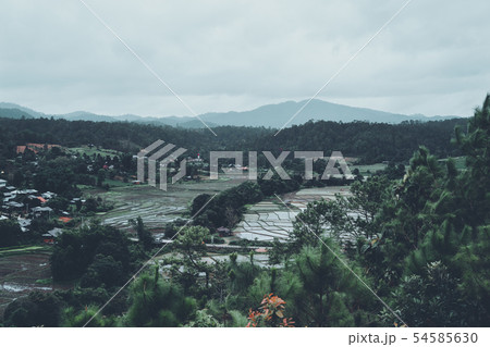 Mountain and village views and fields in the rainy Mountain and village views and fields in the rainy 54585630