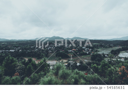 Mountain and village views and fields in the rainy Mountain and village views and fields in the rainy 54585631