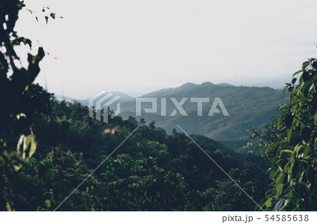 Mountain and village views and fields in the rainy Mountain and village views and fields in the rainy 54585638