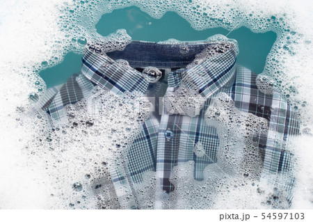 Shirt soak in powder detergent water dissolution. 54597103