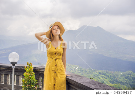 Woman traveler looking at Batur volcano. Indonesia 54599457