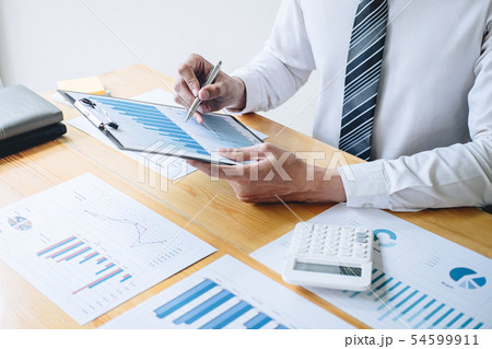 Businessman accountant working analyzing and Businessman accountant working analyzing and 54599911
