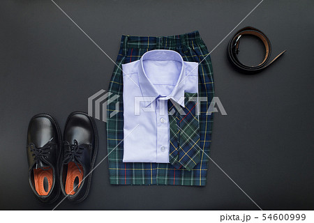 School uniform for boy on black background School uniform for boy on black background 54600999