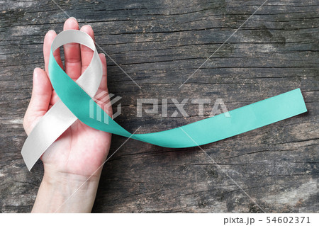 Teal and white ribbon Cervical Cancer awareness 54602371