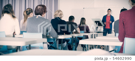 Students with teacher studying in classroom Students with teacher studying in classroom 54602990