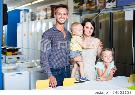 Positive family with two children shopping Positive family with two children shopping 54603152