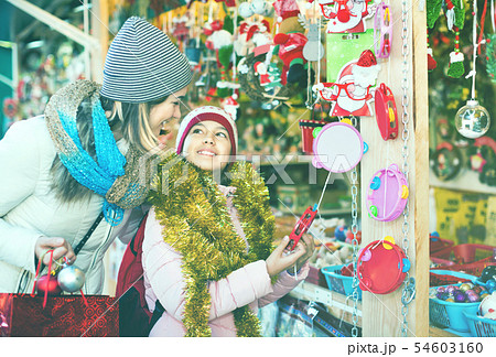Female customers staring at counter of Christmas market 54603160