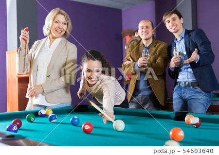 Adults middle class people having pool game Adults middle class people having pool game 54603640