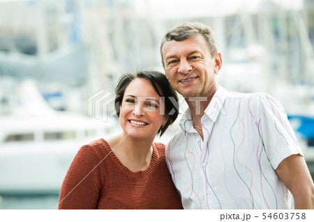 Laughing couple in love posing outdoors 54603758