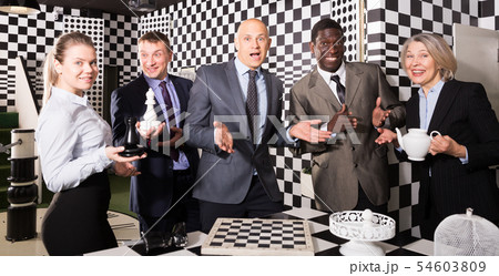 Happy businesspeople in black and white quest room 54603809