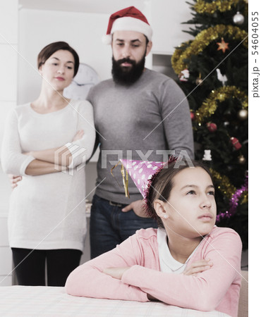 Parents lecturing daughter at Christmas Parents lecturing daughter at Christmas 54604055