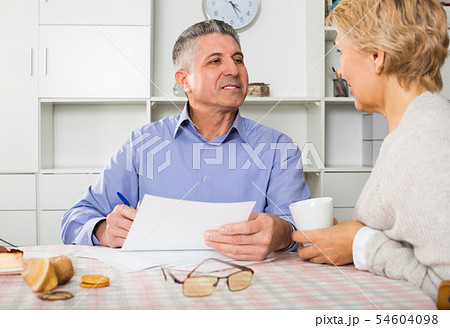 Family of two are discussing and studying important contract Family of two are discussing and studying important contract 54604098