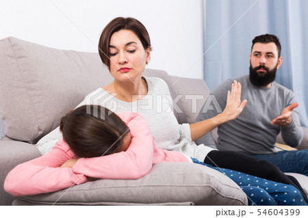 Father lecturing wife and daughter 54604399